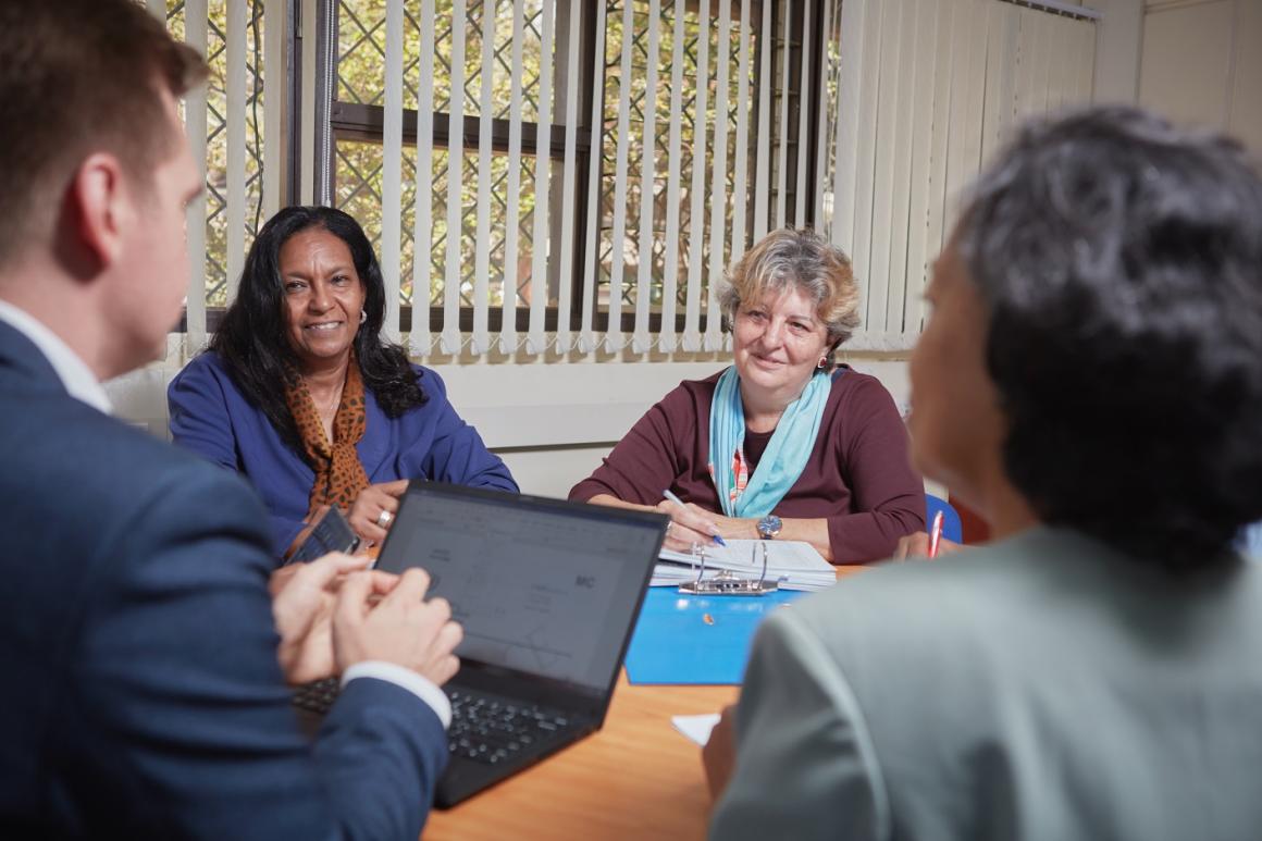 Four Division of Conference Services Staff planning for an upcoming event at the United Nations Office at Nairobi complex