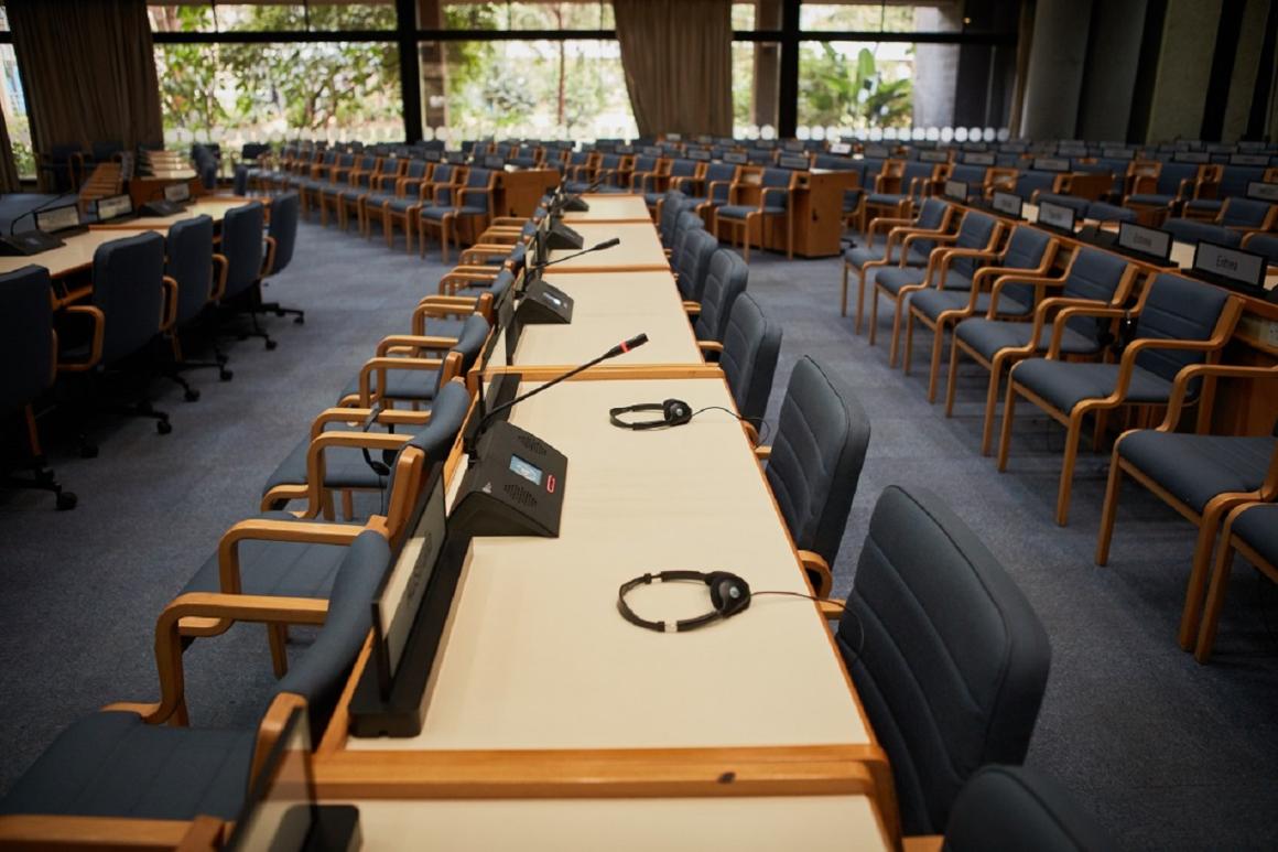 An empty row of seats in a conference room