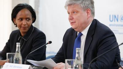 Siim Kiisler, former President of the UN Environment Assembly, speaks at a press event with a woman beside him