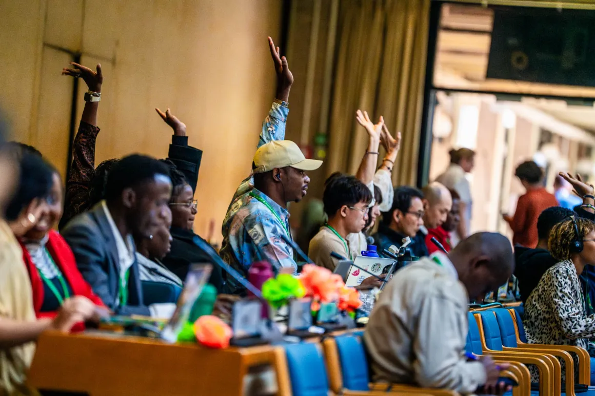 People raise hands to speak