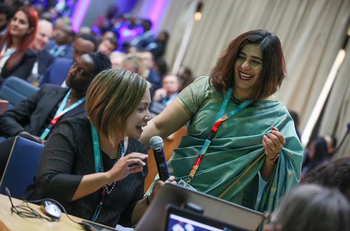Two women laughing together